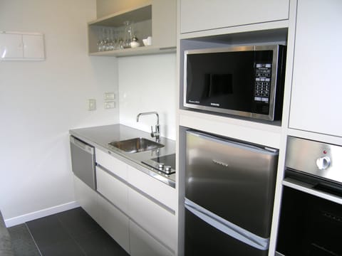 Executive Apartment, 1 Bedroom | Private kitchen | Microwave, coffee/tea maker, toaster
