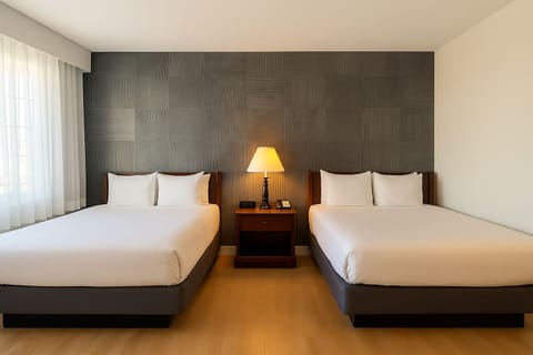 Deluxe Room, 2 Double Beds | Premium bedding, desk, laptop workspace, blackout drapes