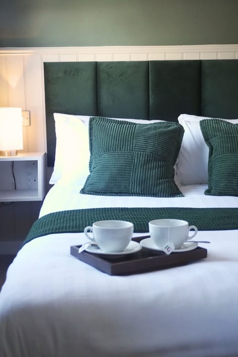 Desk, iron/ironing board, bed sheets