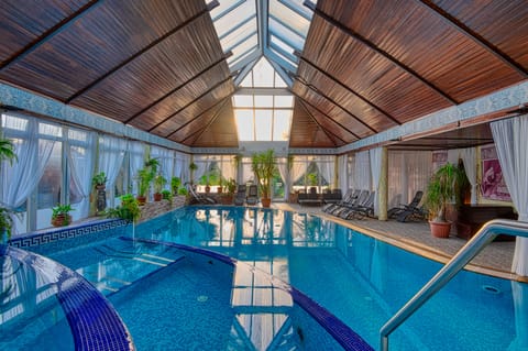 Indoor pool, seasonal outdoor pool, pool umbrellas, sun loungers