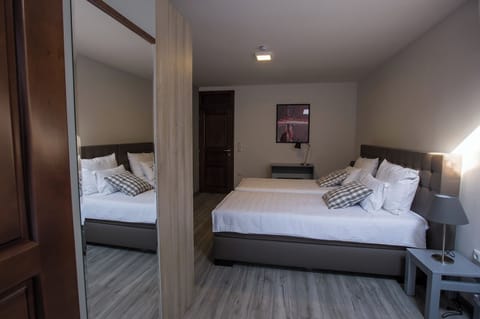 Family Triple Room, 3 Twin Beds | In-room safe, individually furnished, desk, blackout drapes