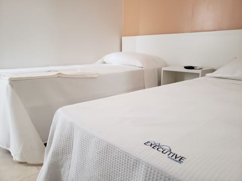 Triple Room | Minibar, in-room safe, desk, blackout drapes