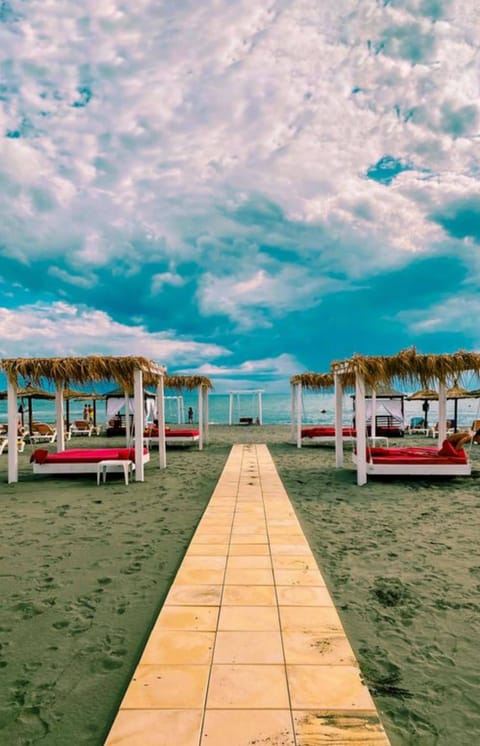 Sun loungers, beach umbrellas, beach towels, beach massages