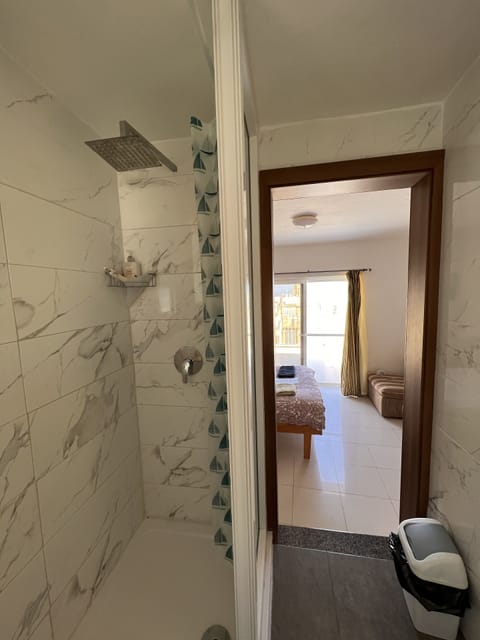 Shower, rainfall showerhead, towels