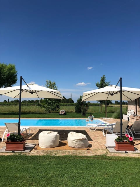 Outdoor pool, pool umbrellas, sun loungers