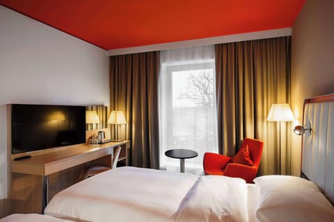 Hypo-allergenic bedding, desk, laptop workspace, blackout drapes