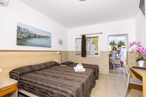 Comfort Triple Room, Garden View | In-room safe, desk, blackout drapes, free WiFi