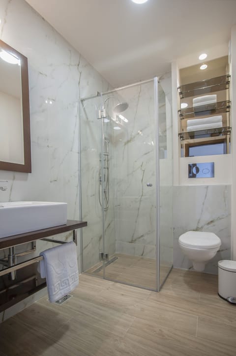 Shower, free toiletries, hair dryer, slippers