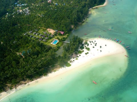 Beach nearby, white sand, beach umbrellas, beach towels