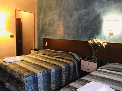 Triple Room | Desk, laptop workspace, blackout drapes, free WiFi