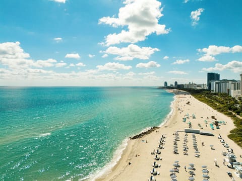 Beach nearby, white sand, beach towels