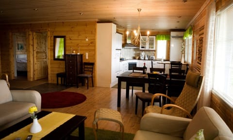 Family Villa, Bay View | Living area | TV, fireplace, DVD player, heated floors