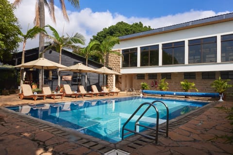 Outdoor pool, open 6:00 AM to 6:00 PM, pool umbrellas, sun loungers