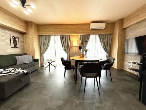 Superior Apartment | Living area | 50-inch flat-screen TV with digital channels, TV, video-game console
