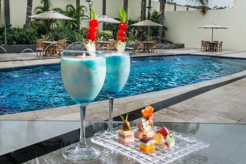 Outdoor pool, pool umbrellas, sun loungers