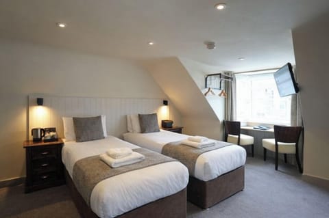 Deluxe Twin | Premium bedding, blackout drapes, iron/ironing board, free WiFi