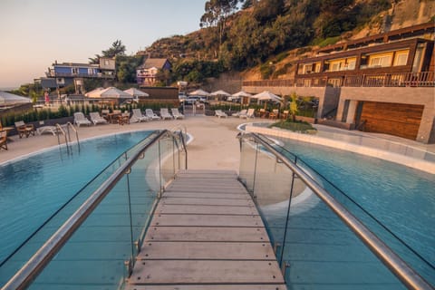 Indoor pool, outdoor pool, open 9:00 AM to 9:00 PM, pool umbrellas