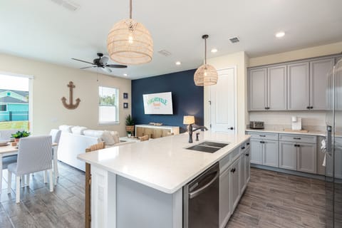 Townhome, Multiple Beds (Deluxe Quadruple Room) | Living area | 55-inch TV with cable channels, streaming services