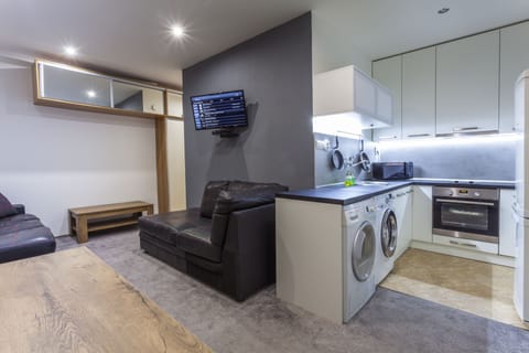Superior Apartment, Multiple Beds, Garden View | Living area | 32-inch LED TV with premium channels, TV