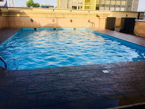 Outdoor pool, pool umbrellas, sun loungers