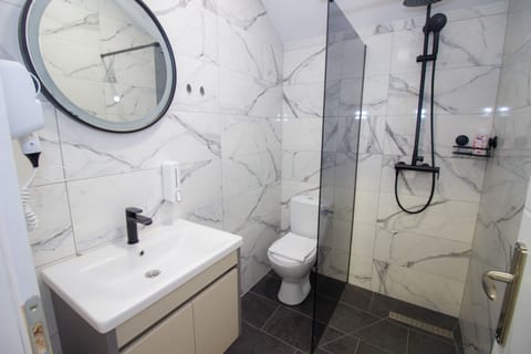 Shower, free toiletries, hair dryer, slippers