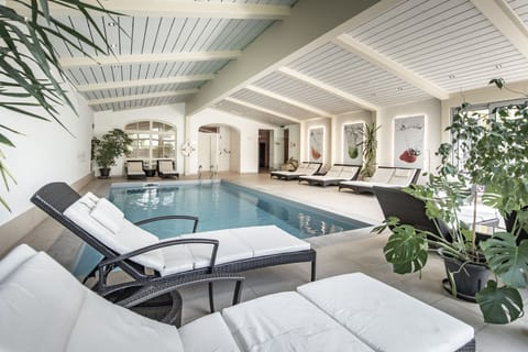 Indoor pool, open 8:00 AM to 8:00 PM, pool umbrellas, sun loungers