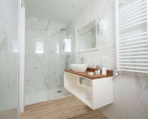 Shower, eco-friendly toiletries, hair dryer, bidet