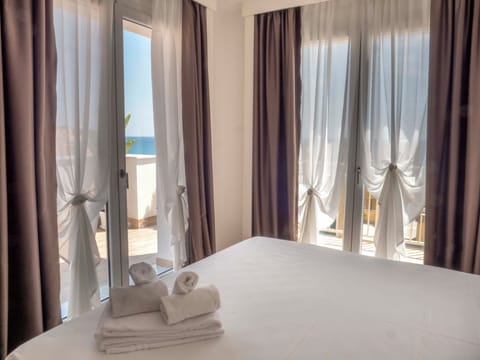 Deluxe Double or Twin Room, Terrace, Sea View | In-room safe, desk, laptop workspace, blackout drapes