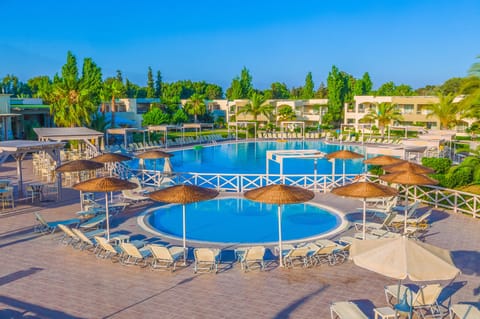 Seasonal outdoor pool, open 10:00 AM to 6:00 PM, pool umbrellas