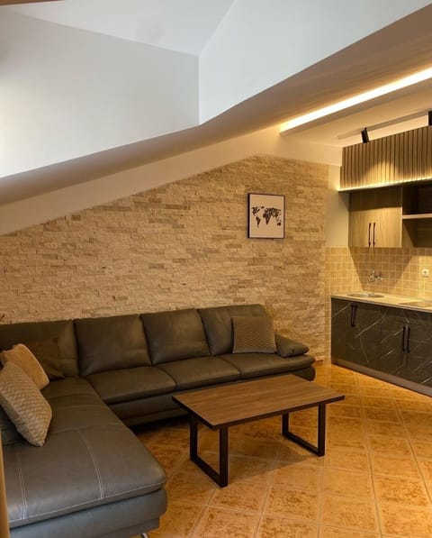 Family Apartment, 1 Bedroom, Pool View | Living area | 32-inch LCD TV with cable channels, TV