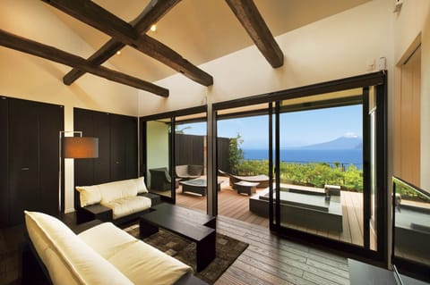 Japanese Western Style Room with Private Open-air Bath, Ocean View  | Living room | Flat-screen TV