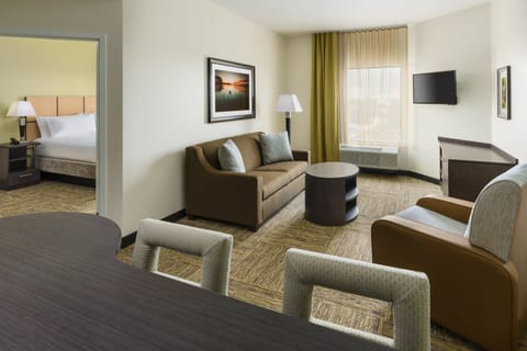 Premium bedding, desk, laptop workspace, blackout drapes