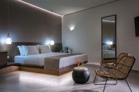 Junior Suite with Outdoor Jetted Tub and Side Sea View | Minibar, in-room safe, individually decorated, individually furnished