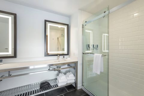 Suite, 1 King Bed with Sofa bed, City View | Bathroom | Hydromassage showerhead, free toiletries, hair dryer, towels