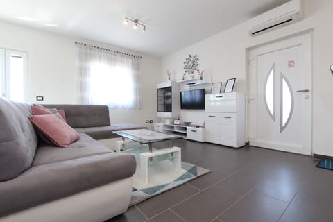 Apartment, 3 Bedrooms | Living area | Flat-screen TV