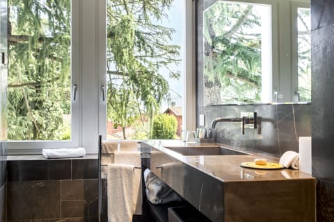 Rainfall showerhead, designer toiletries, hair dryer, slippers