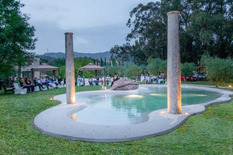 Seasonal outdoor pool, open 10:00 AM to 7:00 PM, pool umbrellas