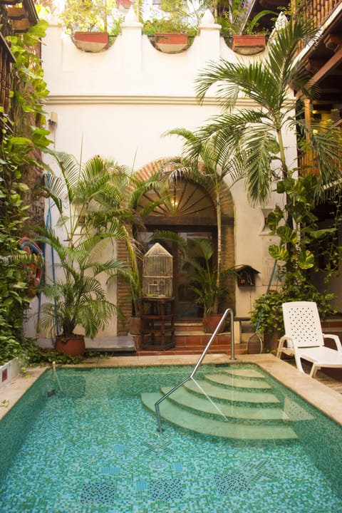 Outdoor pool, open 9:00 AM to 9:00 PM, sun loungers