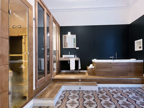 Deluxe Suite, Jetted Tub | Bathroom | Free toiletries, hair dryer, slippers, bidet