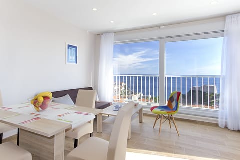 Comfort Apartment, Multiple Beds | Living area | Flat-screen TV