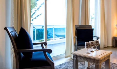 Premium Apartment, Ocean View | Living area | 32-inch flat-screen TV with satellite channels, TV