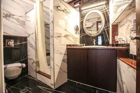 Standard Family Room | Bathroom | Shower, hair dryer, towels, soap