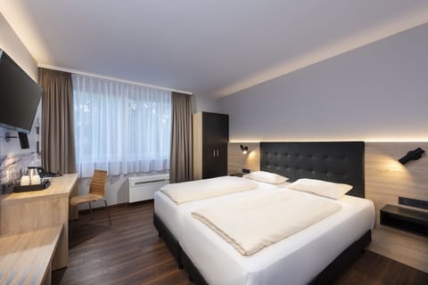 In-room safe, laptop workspace, blackout drapes, soundproofing