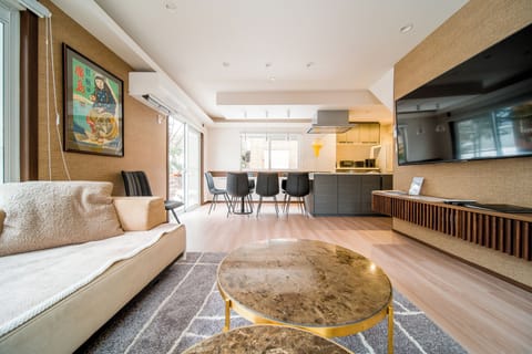 Family House, 5 Bedrooms | Living area | 65-inch Smart TV with cable channels
