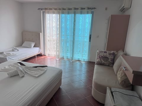 Desk, blackout drapes, bed sheets