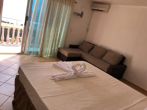 Basic Room, Pool View | Desk, blackout drapes, bed sheets