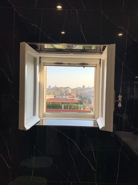 Exclusive Triple Room, City View | Bathroom | Combined shower/tub, rainfall showerhead, free toiletries, hair dryer