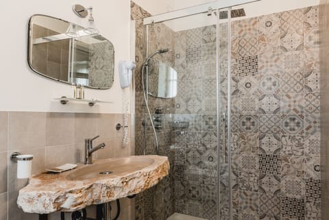 Junior Suite, Garden View | Bathroom | Shower, free toiletries, hair dryer, slippers