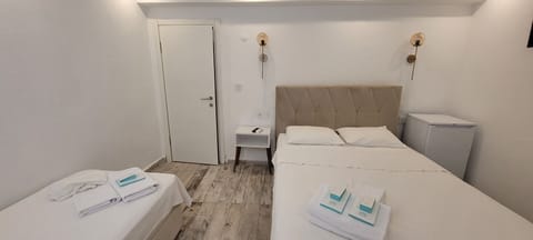 Bodrum Kat Triple Room | Minibar, iron/ironing board, free WiFi, bed sheets