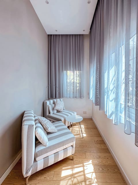 Junior Suite, Patio | Living area | Flat-screen TV